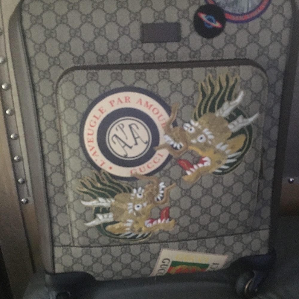 Gucci Supreme limited edition 4 wheel carry on.